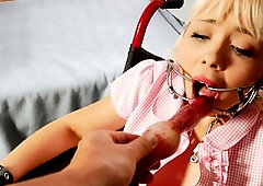 BDSM dom facializing a stranded blonde teen