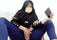 Indonesian hijab aunt wearing cucumber