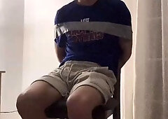 Gagged and duct taped to chair
