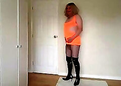 Hot orange dress, fishnets and boots
