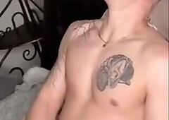 Tattooed guy jerking