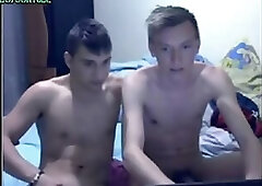 Two friends in front of the webcam masturbate and help each other